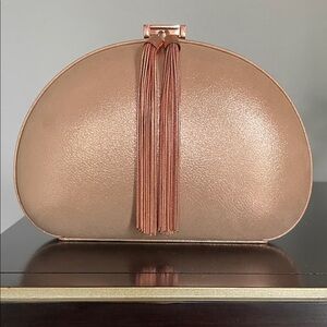Elegant Ted Baker Rose Gold Clutch with Tassel